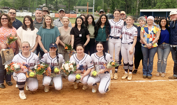 Before Tuesday night's softball game, seniors (kneeling left to right) Carrie Ann Beasley, Erin West, Madison Newburn and Annaston Tate were honored.
